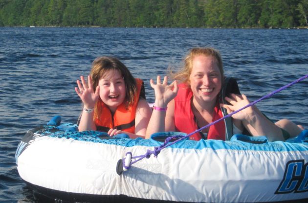 sisters tubing at family camp