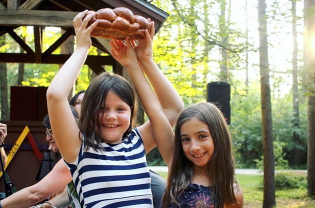 girls holding challah