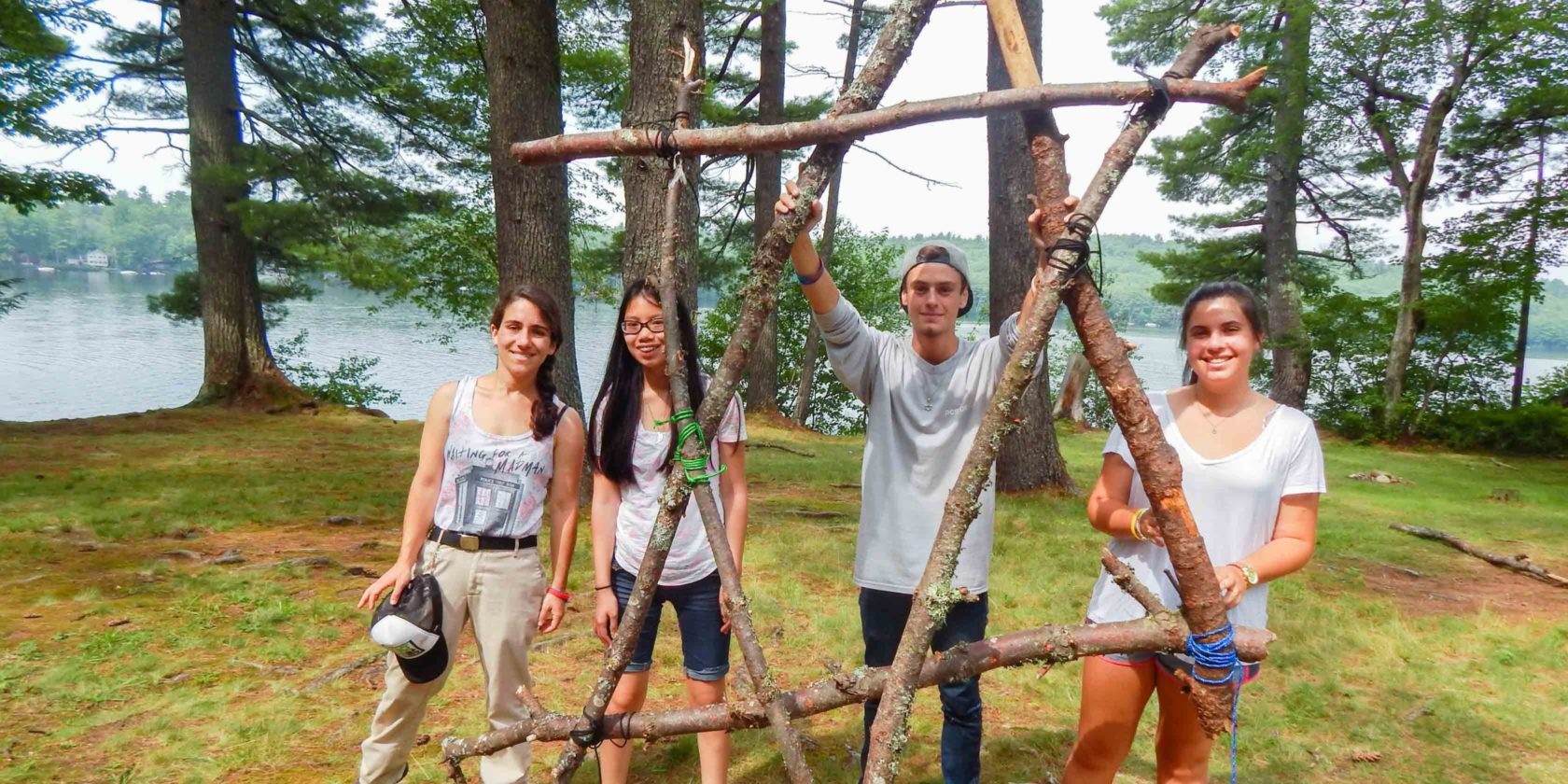 4 campers by wooden star of david