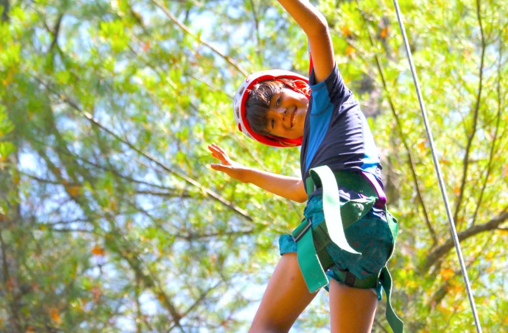 boy on ropes course