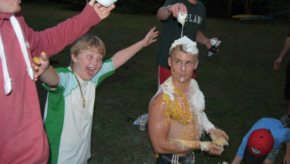 campers cheering while covered in shaving cream