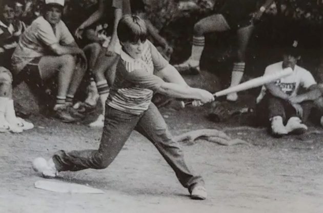 old photo of boy with a baseball bat