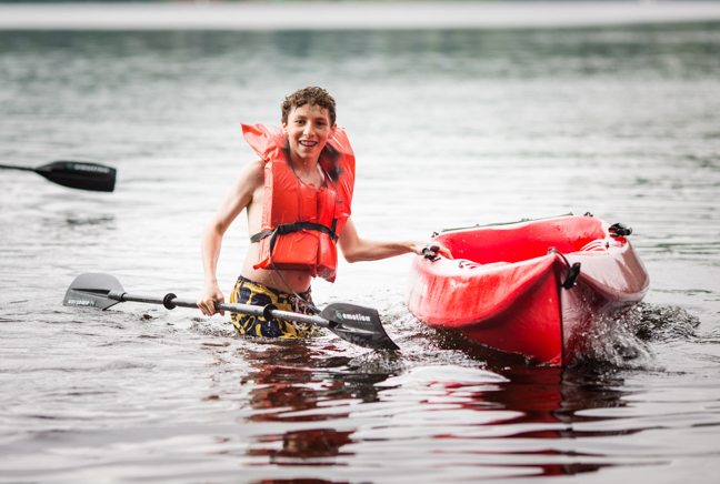 boy boating in the lake