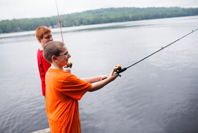 camper fishing in the lake