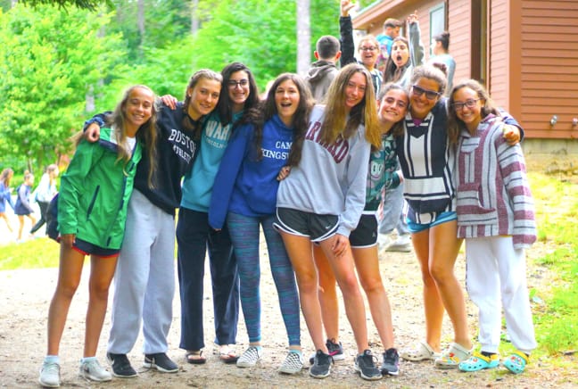 group of girls by their cabin