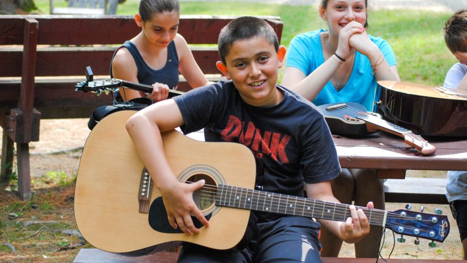 boy playing guitar