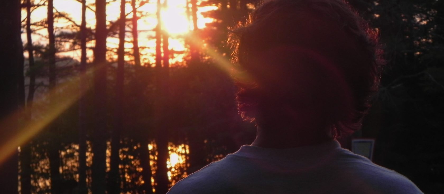 camper watching a sunset