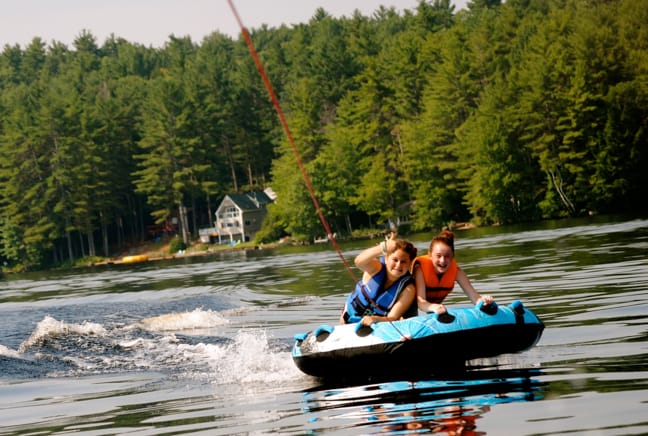 two girls watertubing